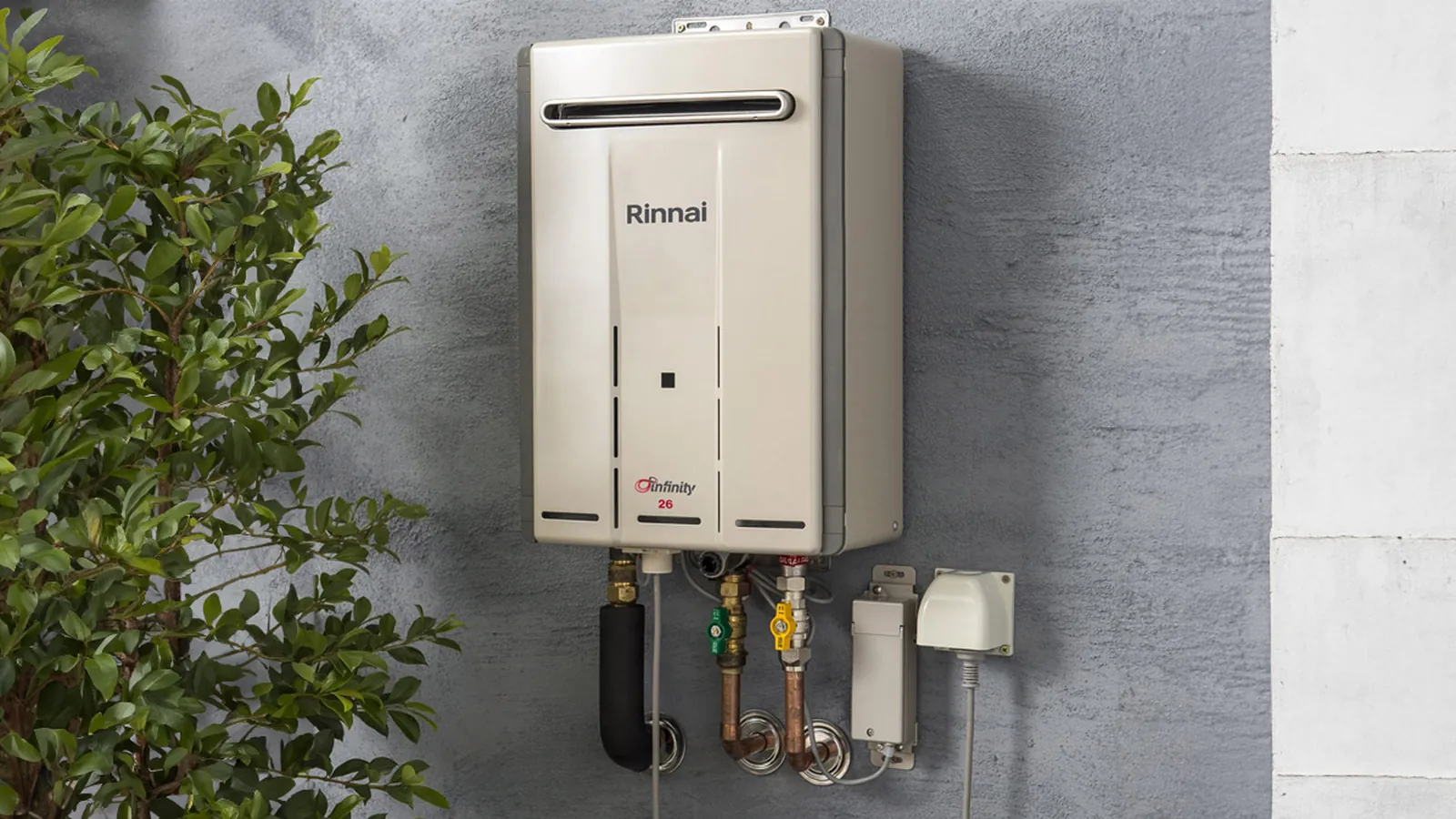 Rinnai continuous flow gas hot water system installed on an exterior wall